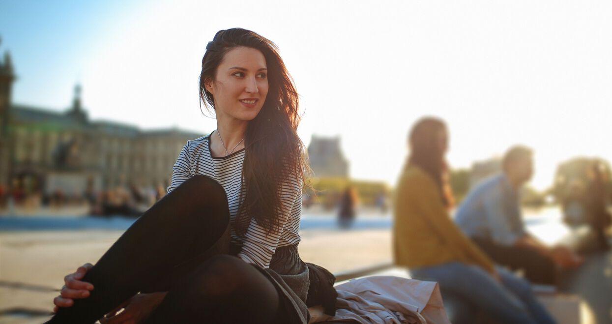 Young woman relaxing in Paris near Louvre museum