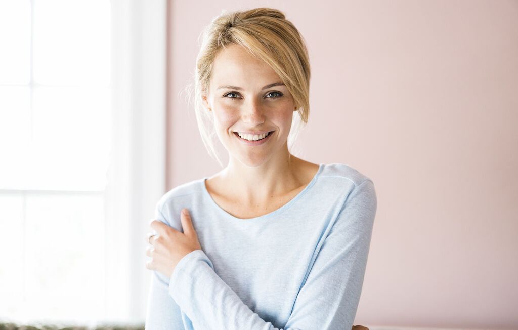 Portrait of smiling young woman at home
