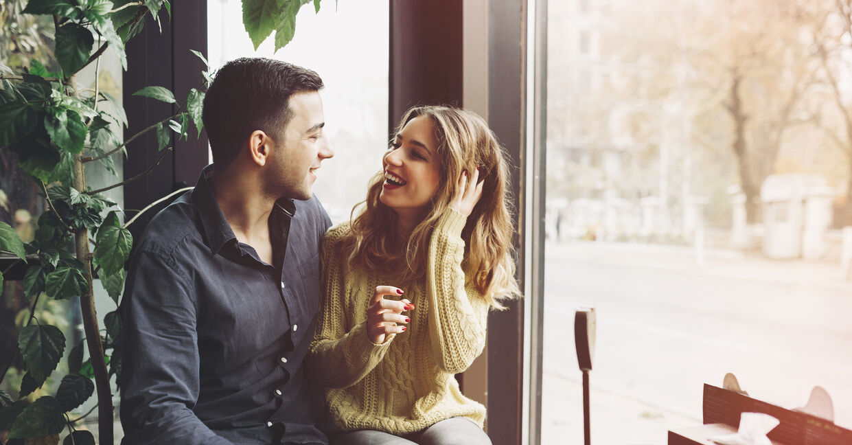 Couple in love drinking coffee and have fun in coffee shop. Love concepts. Vintage effect style picture
