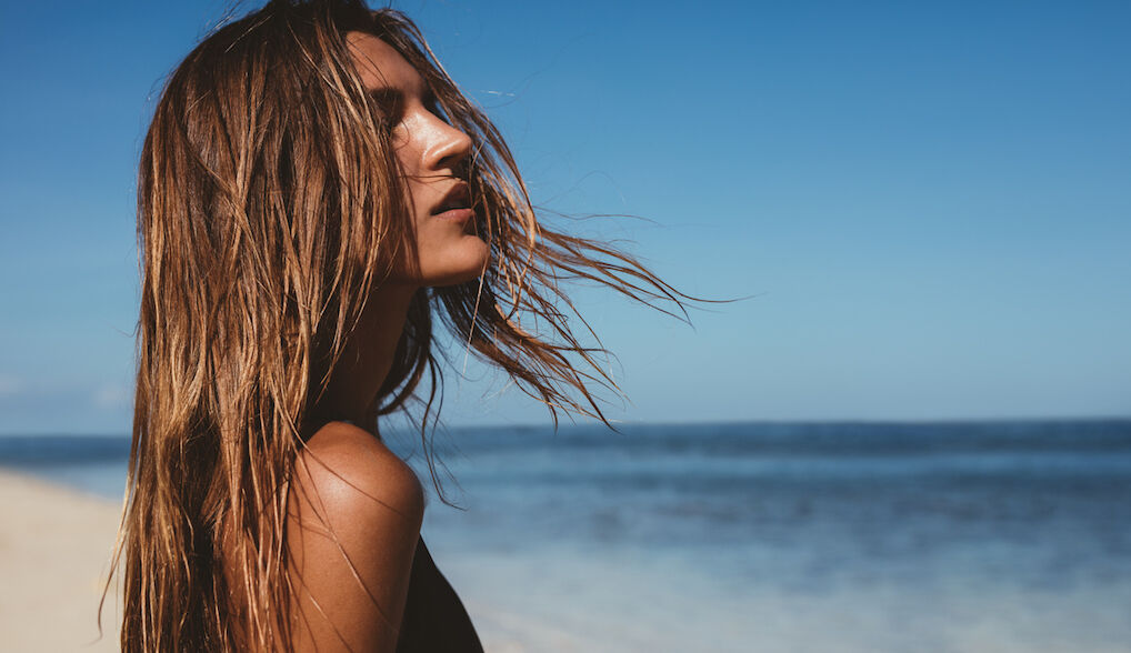 Beautiful young woman on the beach