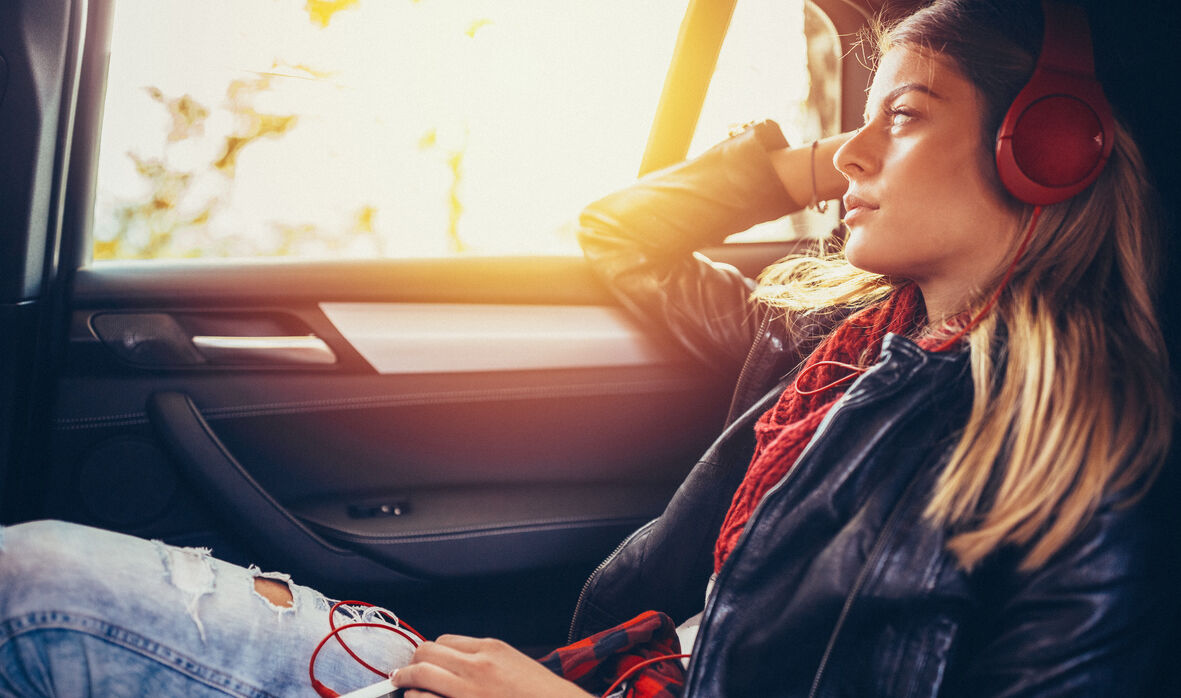 Teenage girl traveling with car