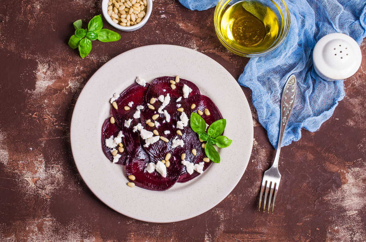 Beetroot salad with cheese and pine nuts. Selective focus.