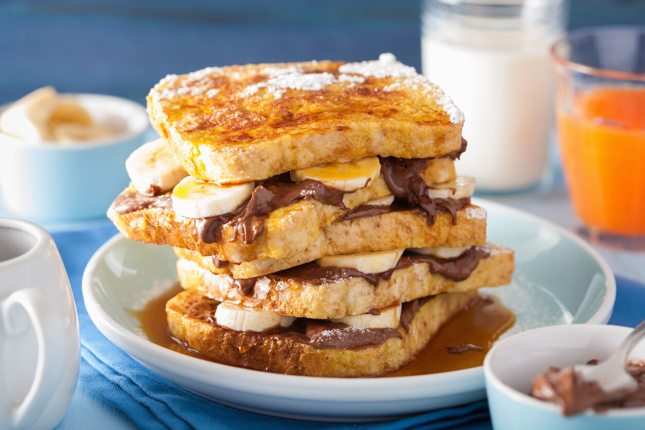 french toasts with banana chocolate sauce and caramel for breakf