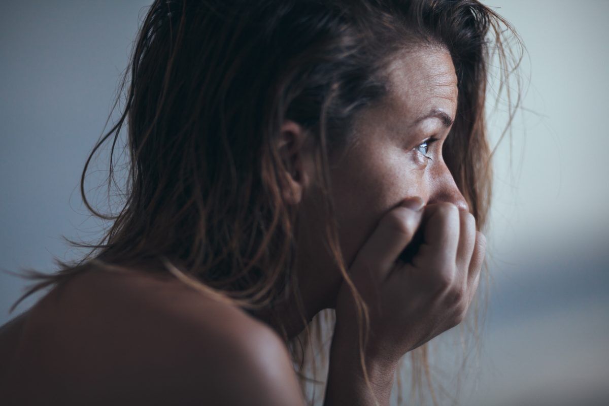 A woman sitting alone and depressed