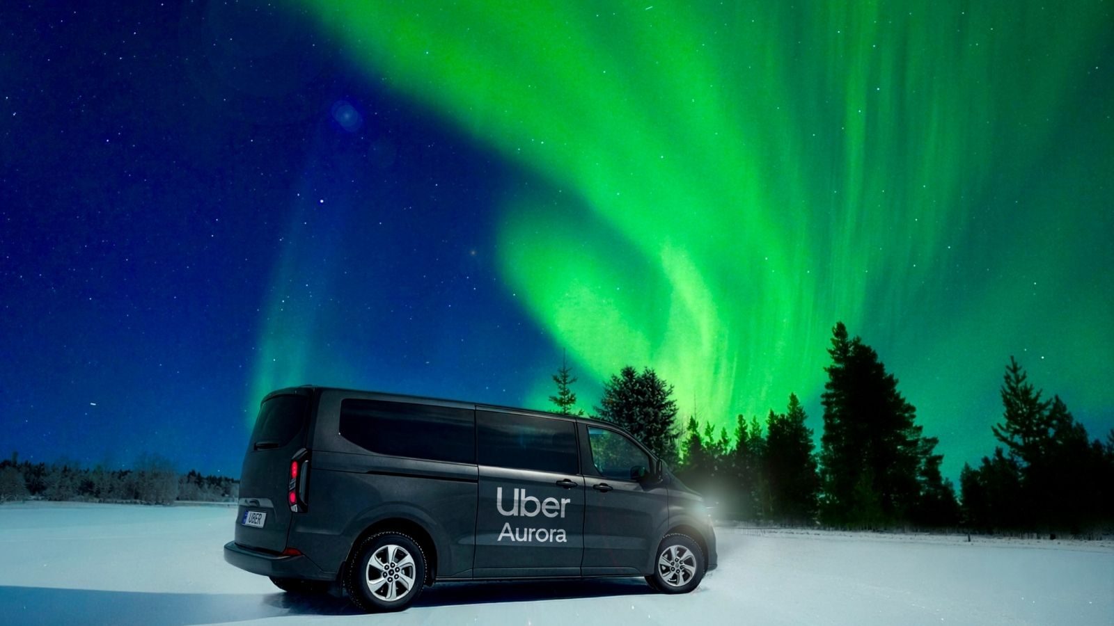Een busje van Uber Aurora onder het noorderlicht.