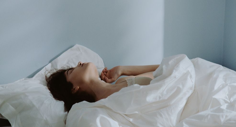 Vrouw in bed.