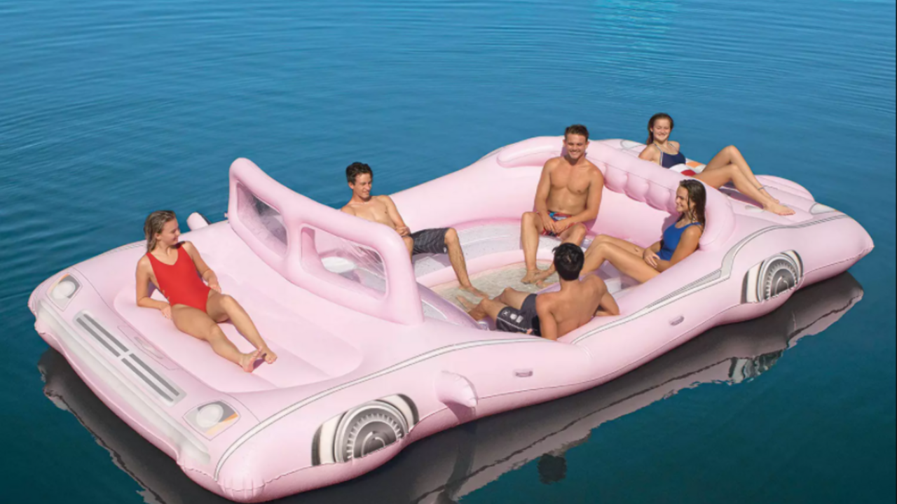 Illustratie voor: Dé hit voor de zomer: deze roze opblaasbare limousine