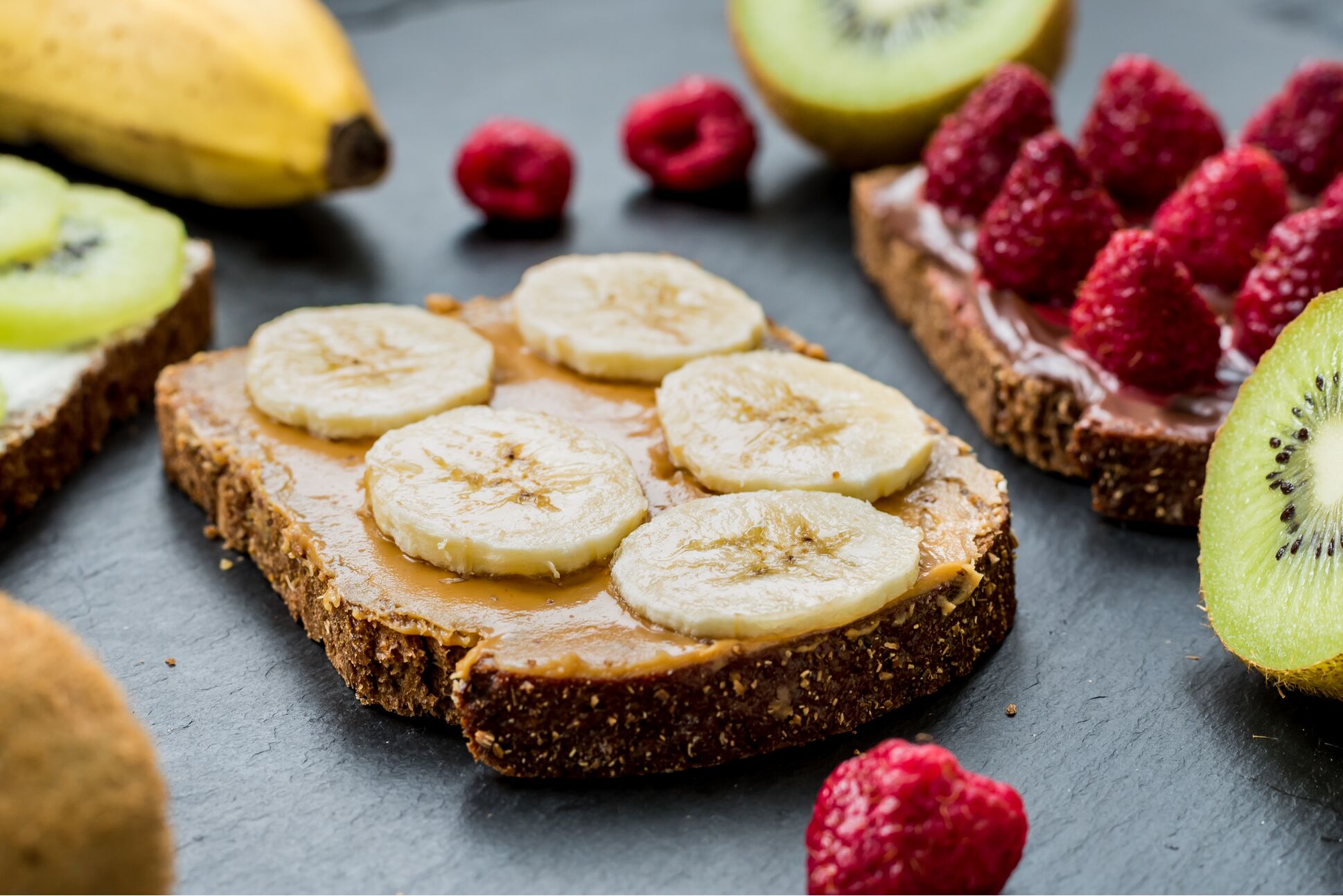 Toasts with raspberries, bananas and kiwi. Healthy lifestyle