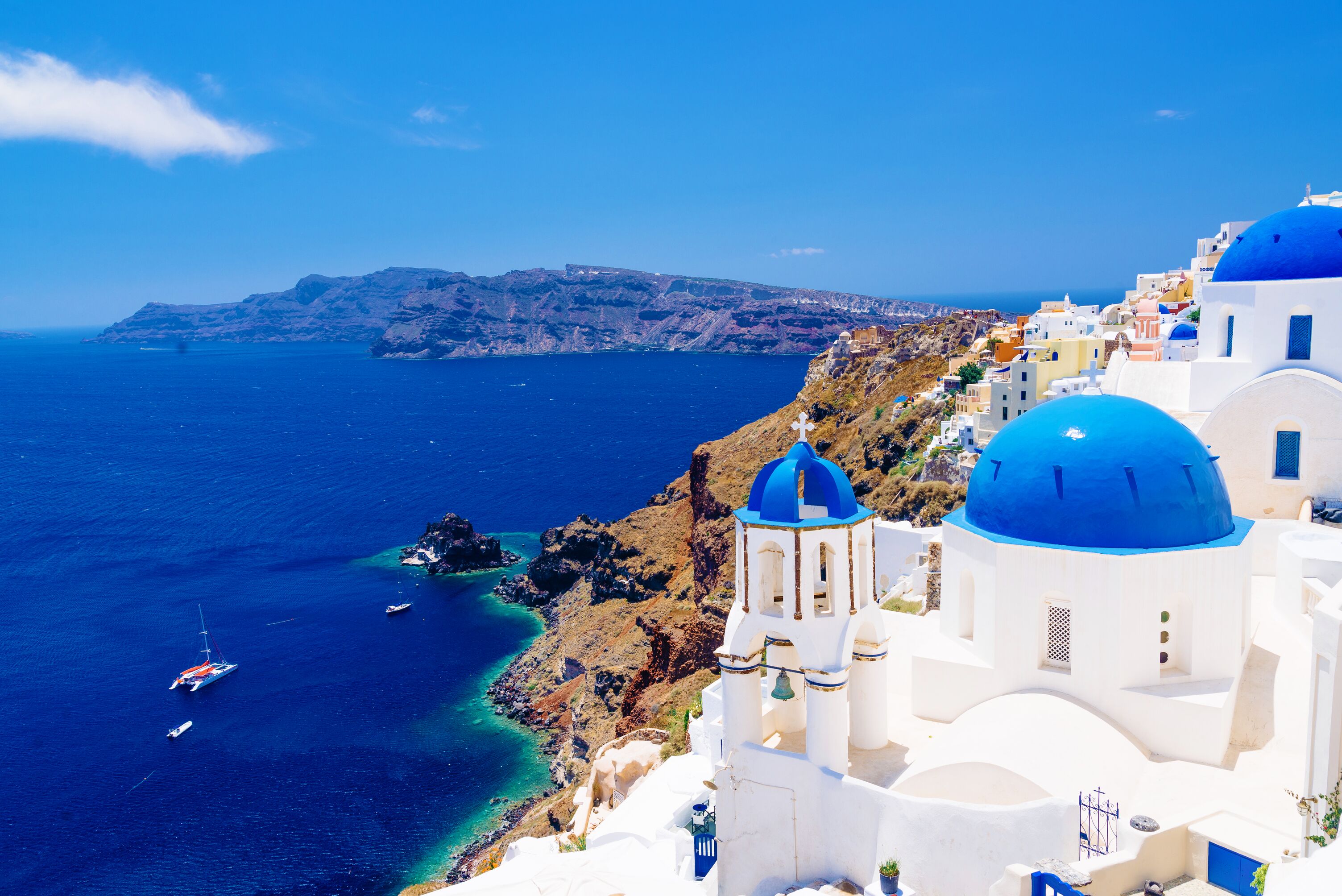 White architecture and famous little churches with blue domes