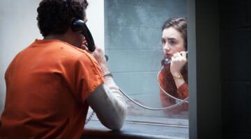 Carole (Lily Collins) bezoekt Ted (Zac Efron) in zijn cel