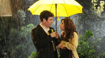 Ted en Tracy onder een gele paraplu.