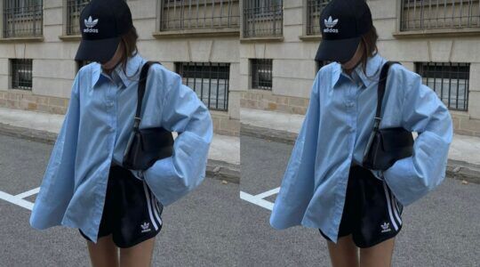 Meisje op de straat met een blauwe blouse en een Adidas broekje.